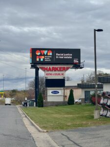 Own It billboard Racial justice in real estate
